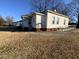 Side view of a white house with a small yard at 1124 S Church St, Rocky Mount, NC 27803