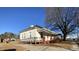 White house with red base, covered porch, and ramp at 1124 S Church St, Rocky Mount, NC 27803