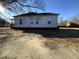 Side view of a white house with a yard at 1124 S Church St, Rocky Mount, NC 27803