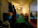 Long hallway with green carpet and a ceiling fan at 1124 S Church St, Rocky Mount, NC 27803