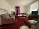 Living room with couches, a TV, and a coffee table at 1124 S Church St, Rocky Mount, NC 27803