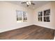 Spacious bedroom with hardwood floors and large windows at 1127 Elmo St, Durham, NC 27701