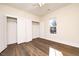 Well-lit bedroom with double closets and wood-look floors at 1127 Elmo St, Durham, NC 27701