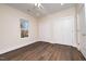 Bedroom with double closets and wood-look flooring at 1127 Elmo St, Durham, NC 27701