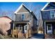 Gray two-story home with wooden porch and walkway at 1127 Elmo St, Durham, NC 27701