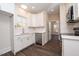 Modern kitchen with white cabinets and marble countertops at 1127 Elmo St, Durham, NC 27701
