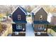 Two-story homes with private driveways and fenced yards at 1129 Elmo St, Durham, NC 27701