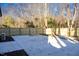 Large backyard with a concrete patio and wooden fence at 1129 Elmo St, Durham, NC 27701