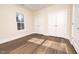 Spacious bedroom with double closets and wood-look vinyl flooring at 1129 Elmo St, Durham, NC 27701