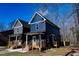 Two story home with navy blue siding and a front yard at 1129 Elmo St, Durham, NC 27701