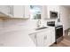 Modern kitchen with white cabinets and stainless steel appliances at 1129 Elmo St, Durham, NC 27701