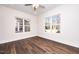 Living room featuring hardwood floors and multiple windows at 1129 Elmo St, Durham, NC 27701