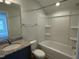 Granite vanity top complements the tub and shower combo at 137 Stallion Way, Benson, NC 27504