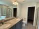 Bathroom features double vanity, granite countertops, and tile shower at 137 Stallion Way, Benson, NC 27504
