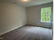 Bright bedroom features natural light and neutral walls at 137 Stallion Way, Benson, NC 27504
