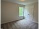 Bright bedroom features a window and a closet at 137 Stallion Way, Benson, NC 27504