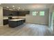 Spacious kitchen features an island, stainless appliances, granite countertops, and ample natural light at 137 Stallion Way, Benson, NC 27504