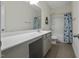 Shared bathroom with double vanity, bathtub, and shower at 148 Cumberland Dr, Sanford, NC 27332