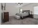 Spacious bedroom with king-size bed, ample closet space, and ceiling fan at 148 Cumberland Dr, Sanford, NC 27332