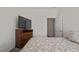 Bedroom with a double bed, TV stand, and access to hallway at 148 Cumberland Dr, Sanford, NC 27332