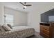 Bedroom featuring a double bed, TV, and ceiling fan at 148 Cumberland Dr, Sanford, NC 27332