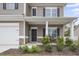 Front porch with stone accents and a welcome sign at 148 Cumberland Dr, Sanford, NC 27332