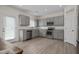 Modern kitchen with stainless steel appliances and gray cabinets at 148 Cumberland Dr, Sanford, NC 27332