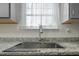 Modern kitchen sink with chrome faucet and drying rack at 148 Cumberland Dr, Sanford, NC 27332