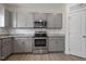 Stainless steel appliances and granite countertops in this kitchen at 148 Cumberland Dr, Sanford, NC 27332