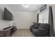 Living room with gray reclining sofas and a large TV at 148 Cumberland Dr, Sanford, NC 27332