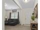 Living room with gray reclining sofas and a view of the front door at 148 Cumberland Dr, Sanford, NC 27332