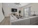 Living room with sectional sofa, large TV, and ceiling fan at 148 Cumberland Dr, Sanford, NC 27332