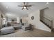 Spacious living room with gray sectional sofa and ceiling fan at 148 Cumberland Dr, Sanford, NC 27332