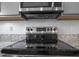 Close-up of a modern, stainless steel rangetop at 148 Cumberland Dr, Sanford, NC 27332