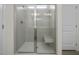 Large walk-in shower with built-in bench and glass enclosure at 148 Cumberland Dr, Sanford, NC 27332
