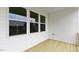New back porch features wood flooring and white vinyl siding at 155 Scenic Rock Dr, Youngsville, NC 27596