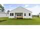 View of the home and back porch from the backyard at 155 Scenic Rock Dr, Youngsville, NC 27596