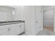 Modern bathroom with double vanity sinks and a walk-in closet for ample storage at 155 Scenic Rock Dr, Youngsville, NC 27596
