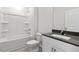 Clean bathroom featuring a shower-tub combo and a modern vanity with solid surface countertops at 155 Scenic Rock Dr, Youngsville, NC 27596