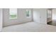 Spacious bedroom with dual windows offering natural light and outdoor views at 155 Scenic Rock Dr, Youngsville, NC 27596