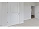 Bright bedroom features plush carpeting, fresh paint, and a double-door closet at 155 Scenic Rock Dr, Youngsville, NC 27596