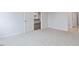 Open bedroom layout with access to the kitchen and additional living space at 155 Scenic Rock Dr, Youngsville, NC 27596