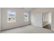 Bedroom with two windows and access to another room at 155 Scenic Rock Dr, Youngsville, NC 27596