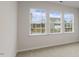 Bright bedroom with three windows and neutral wall at 155 Scenic Rock Dr, Youngsville, NC 27596