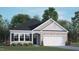 Newly constructed home with a two-car garage and landscaped yard at 155 Scenic Rock Dr, Youngsville, NC 27596