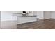 Modern kitchen with a center island, white cabinets, and stainless steel appliances at 155 Scenic Rock Dr, Youngsville, NC 27596