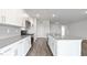 Bright modern kitchen with stainless steel appliances and white shaker style cabinets at 155 Scenic Rock Dr, Youngsville, NC 27596