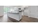 Contemporary kitchen with white cabinets, an island, and stainless steel appliances at 155 Scenic Rock Dr, Youngsville, NC 27596