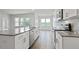 Well-lit kitchen featuring white cabinets, stainless steel appliances, and granite countertops at 155 Scenic Rock Dr, Youngsville, NC 27596