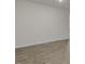 Spacious living room with hardwood floors and neutral walls at 155 Scenic Rock Dr, Youngsville, NC 27596